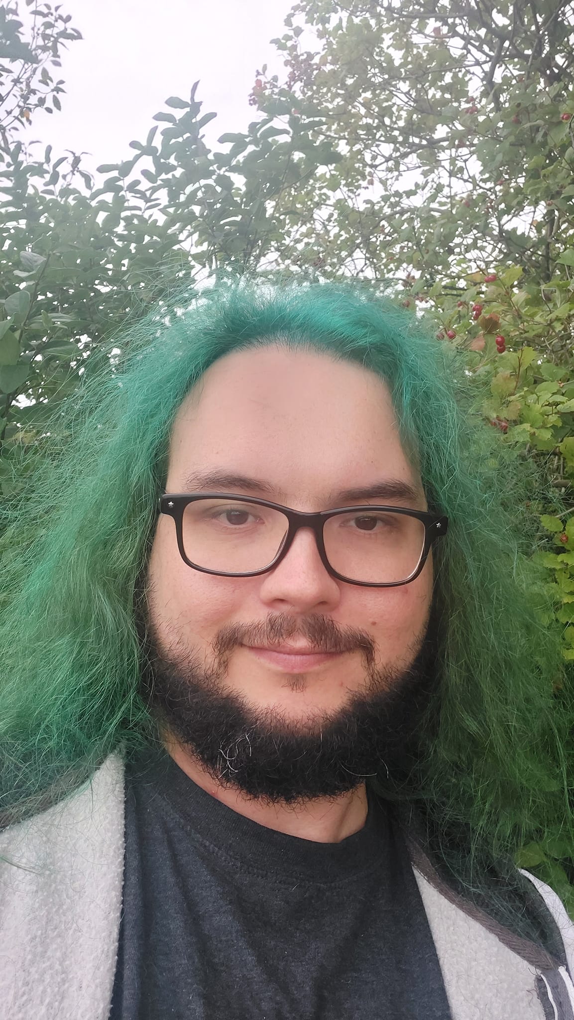 A man with green hair is visiting a freshwater marsh, photo 6